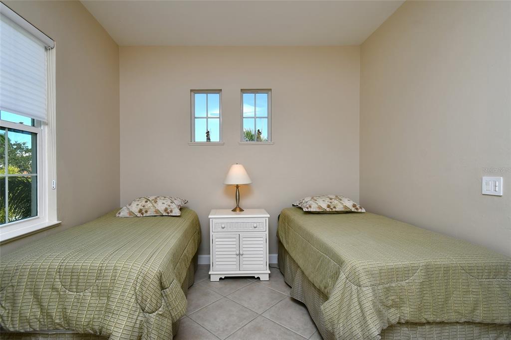3454 Sunset Key Circle, Unit 103 Punta Gorda, FL 33955 - Photo 7 of 37 a bedroom with a bed and a window