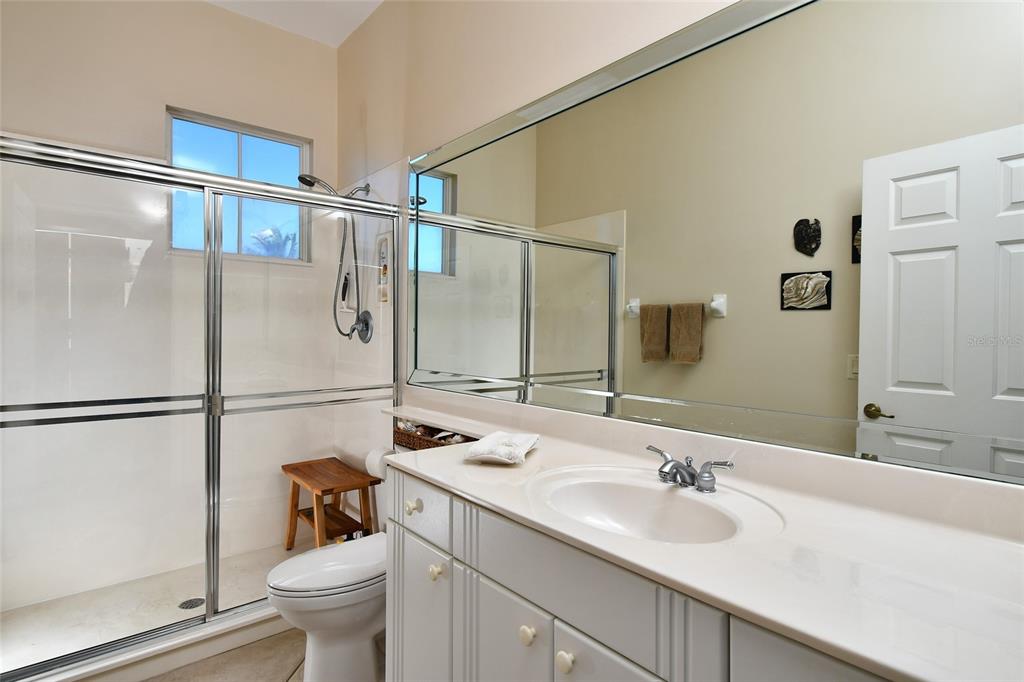 3454 Sunset Key Circle, Unit 103 Punta Gorda, FL 33955 - Photo 10 of 37 a bathroom with a sink toilet and shower