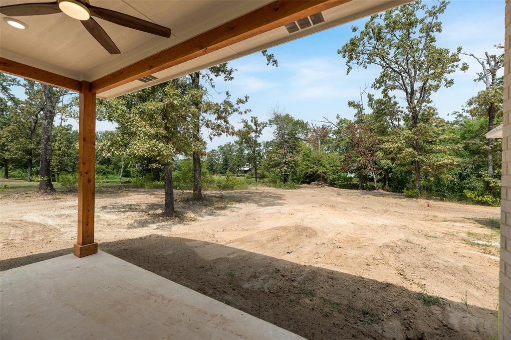 322 Rs Co Road Alba, TX 75410 - Photo 26 of 37 View of yard featuring a ceiling fan and a patio