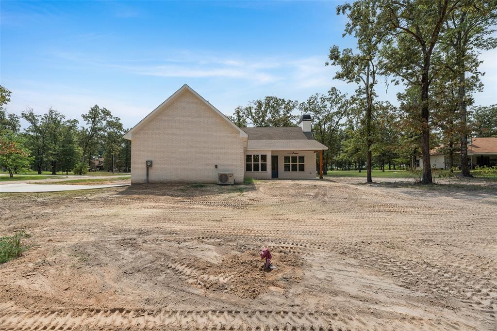 322 Rs Co Road Alba, TX 75410 - Photo 28 of 37 Rear view of property featuring brick siding and a chimney