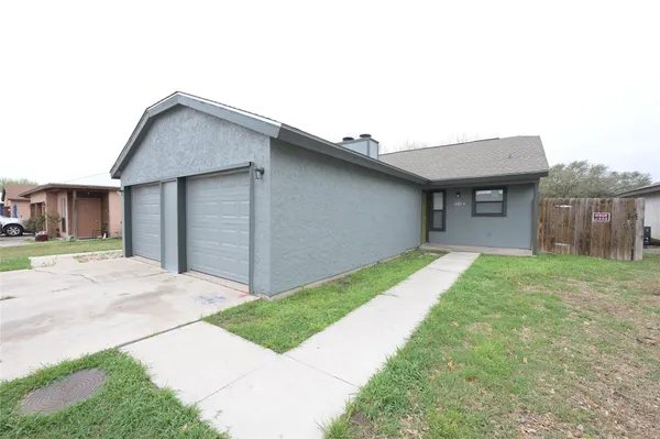 a house view with a garden space