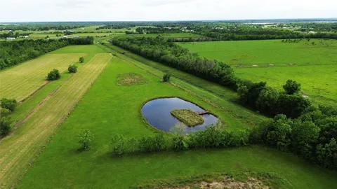 a view of a green field with clear sky