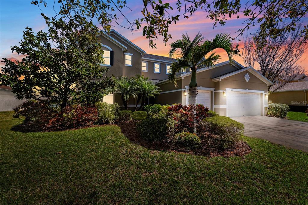 5323 Sandy Shell Drive Apollo Beach, FL 33572 - Photo 1 of 1 a front view of a house with a garden