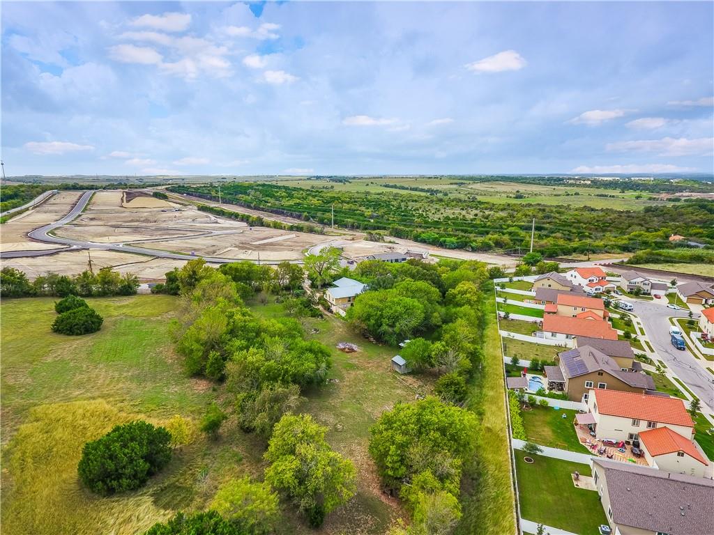13331 Bradshaw Road Austin, TX 78747 - Photo 6 of 14 Mature trees and open green space define this expansive property bordering a developing neighborhood.