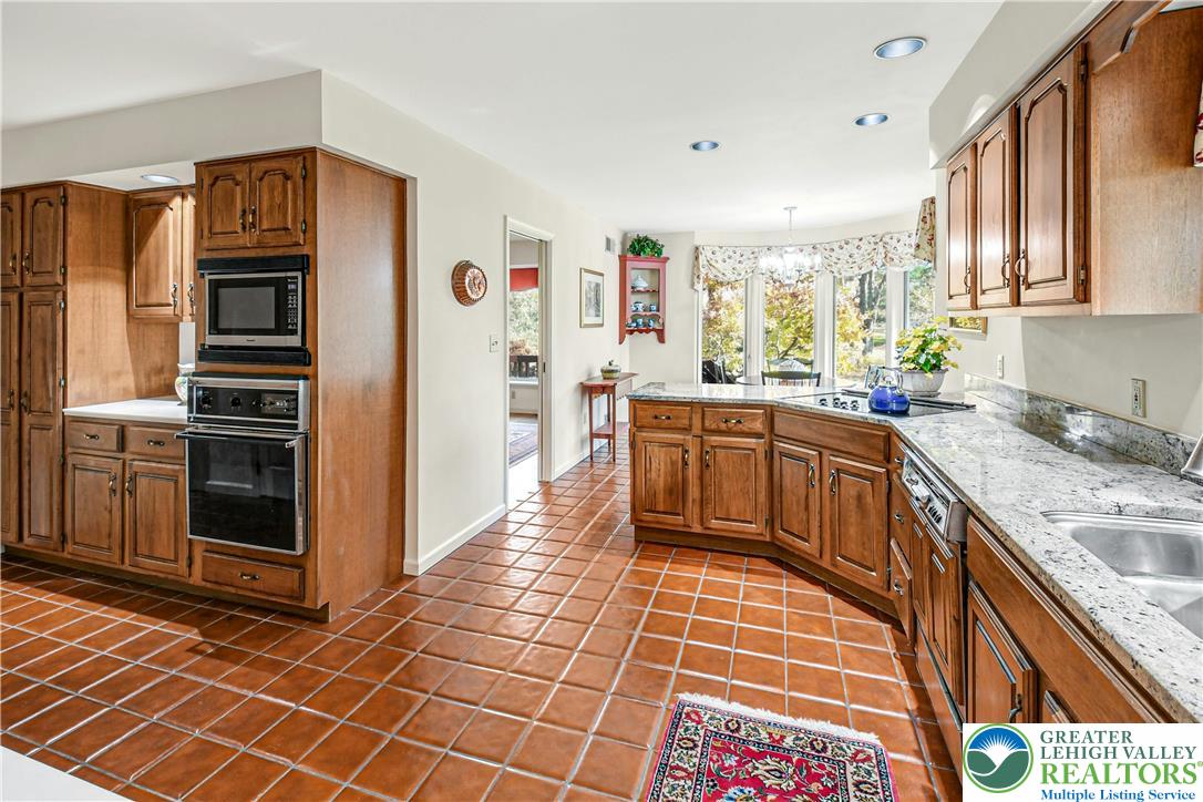 1588 Saucon Valley Road Bethlehem, PA 18015 - Photo 15 of 35 a kitchen with stainless steel appliances a sink stove and refrigerator