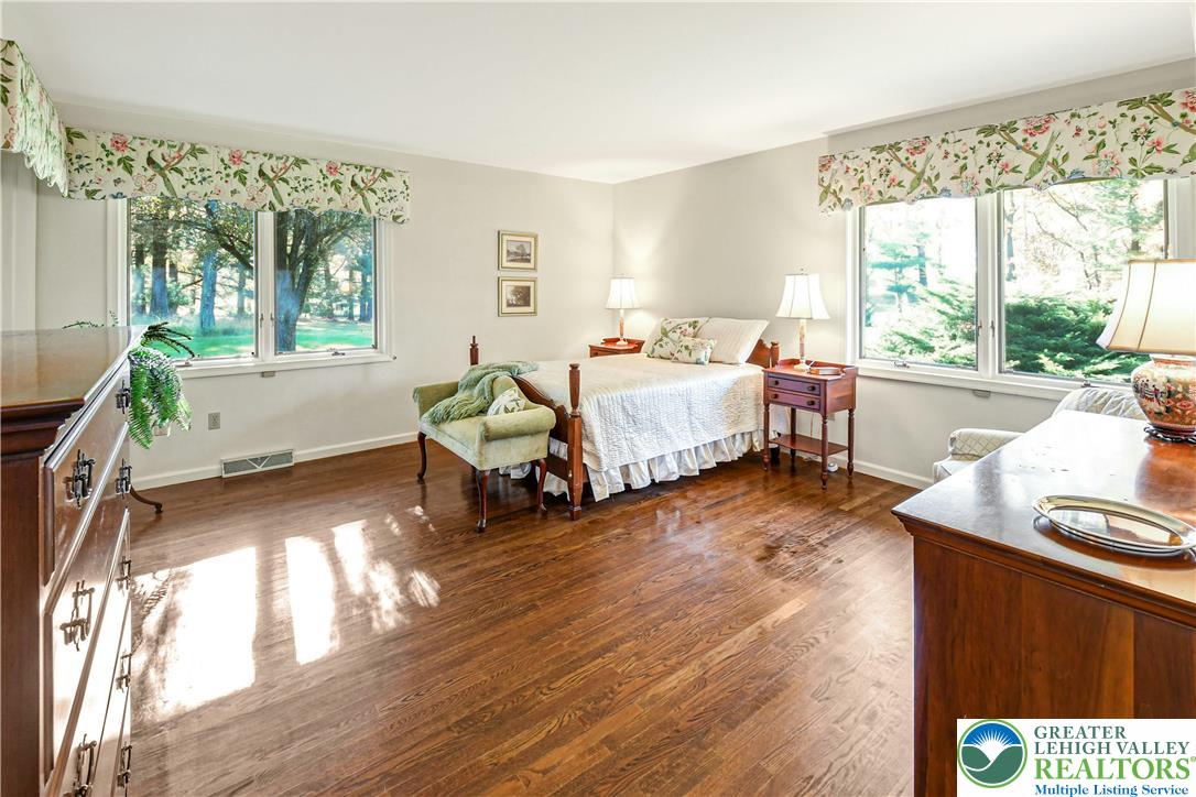 1588 Saucon Valley Road Bethlehem, PA 18015 - Photo 17 of 35 a spacious bedroom with a bed and a window