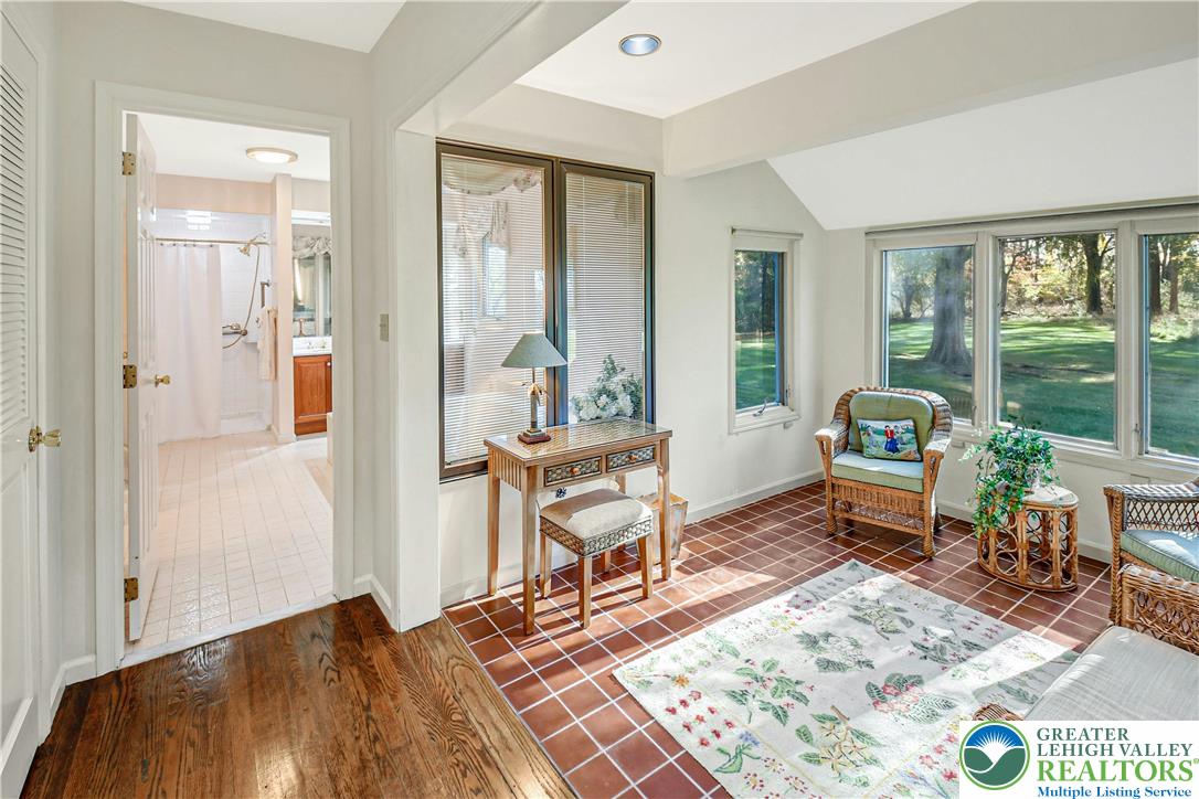 1588 Saucon Valley Road Bethlehem, PA 18015 - Photo 19 of 35 a living room with furniture and a table