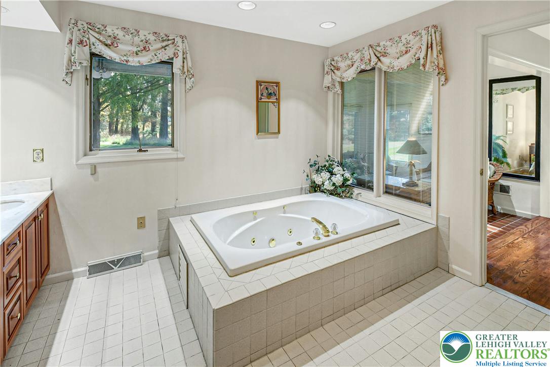 1588 Saucon Valley Road Bethlehem, PA 18015 - Photo 20 of 35 a living room with a couch and a table