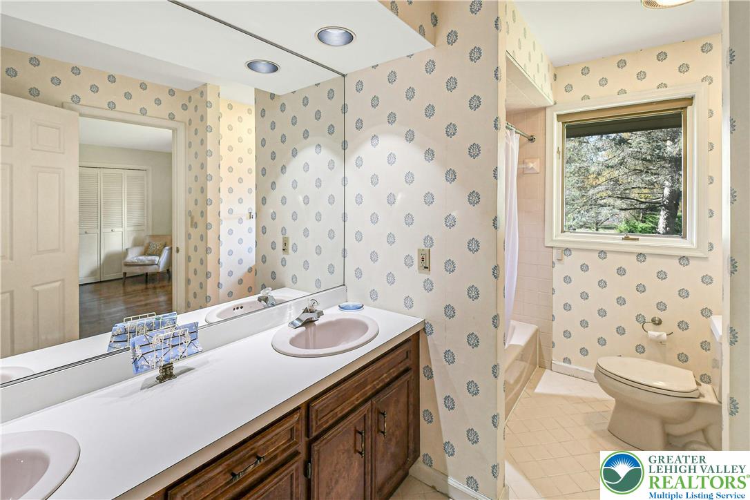 1588 Saucon Valley Road Bethlehem, PA 18015 - Photo 22 of 35 a bathroom with a sink toilet and shower