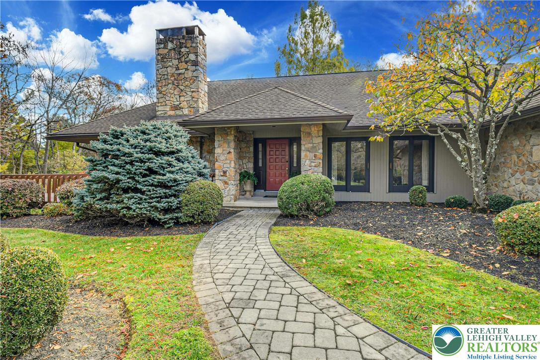 1588 Saucon Valley Road Bethlehem, PA 18015 - Photo 4 of 35 a front view of a house with garden