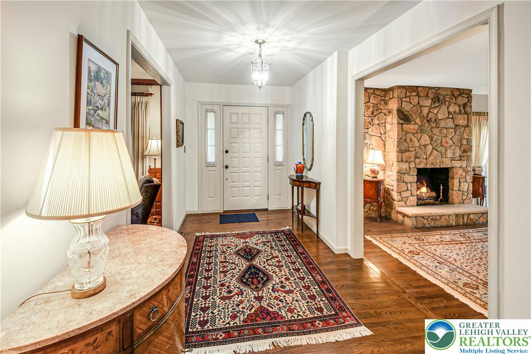 1588 Saucon Valley Road Bethlehem, PA 18015 - Photo 6 of 35 a living room with furniture and a fireplace