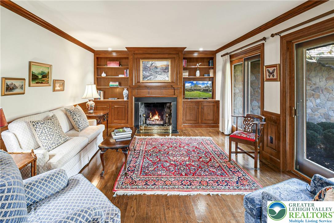 1588 Saucon Valley Road Bethlehem, PA 18015 - Photo 9 of 35 a living room with furniture a rug and a fireplace