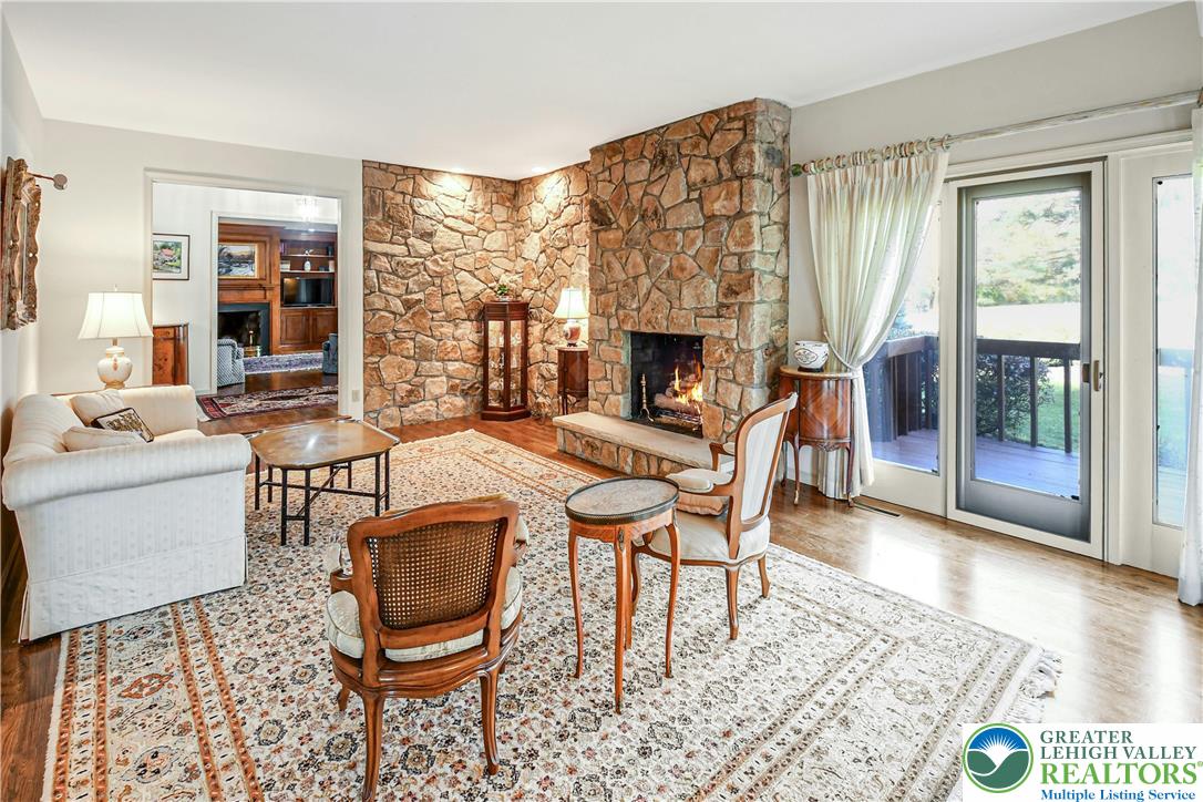1588 Saucon Valley Road Bethlehem, PA 18015 - Photo 10 of 35 a living room with furniture a fireplace and a table
