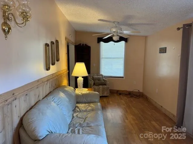 a living room with furniture and a lamp