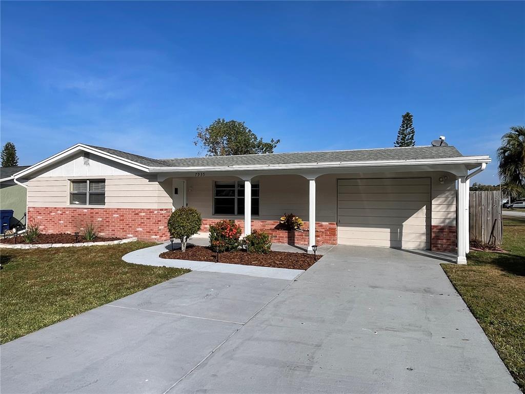 7935 Yucca Drive New Port Richey, FL 34653 - Photo 1 of 1 a front view of a house with patio