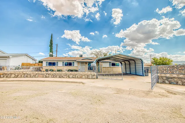 a view of a house with basketball court