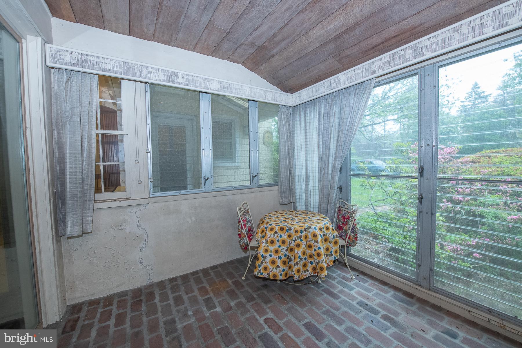 826 West King Road Malvern, PA 19355 - Photo 17 of 43 Brick floor enclosed Sun Room.