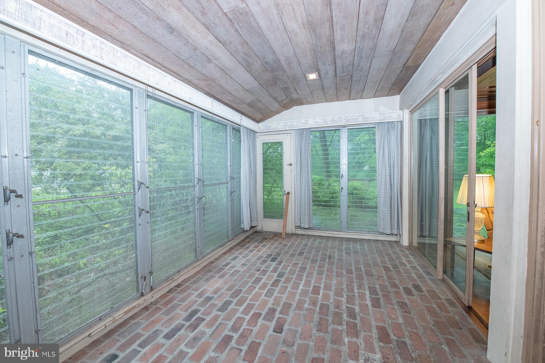 826 West King Road Malvern, PA 19355 - Photo 18 of 43 Sun Room accesses back yard. Lots of light.