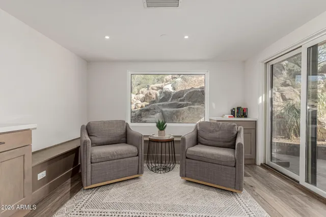 a bedroom with furniture and a fireplace