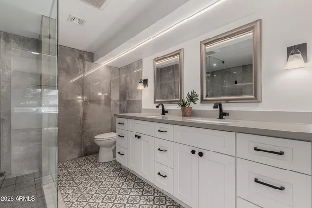 a bedroom with a bed a desk and chair