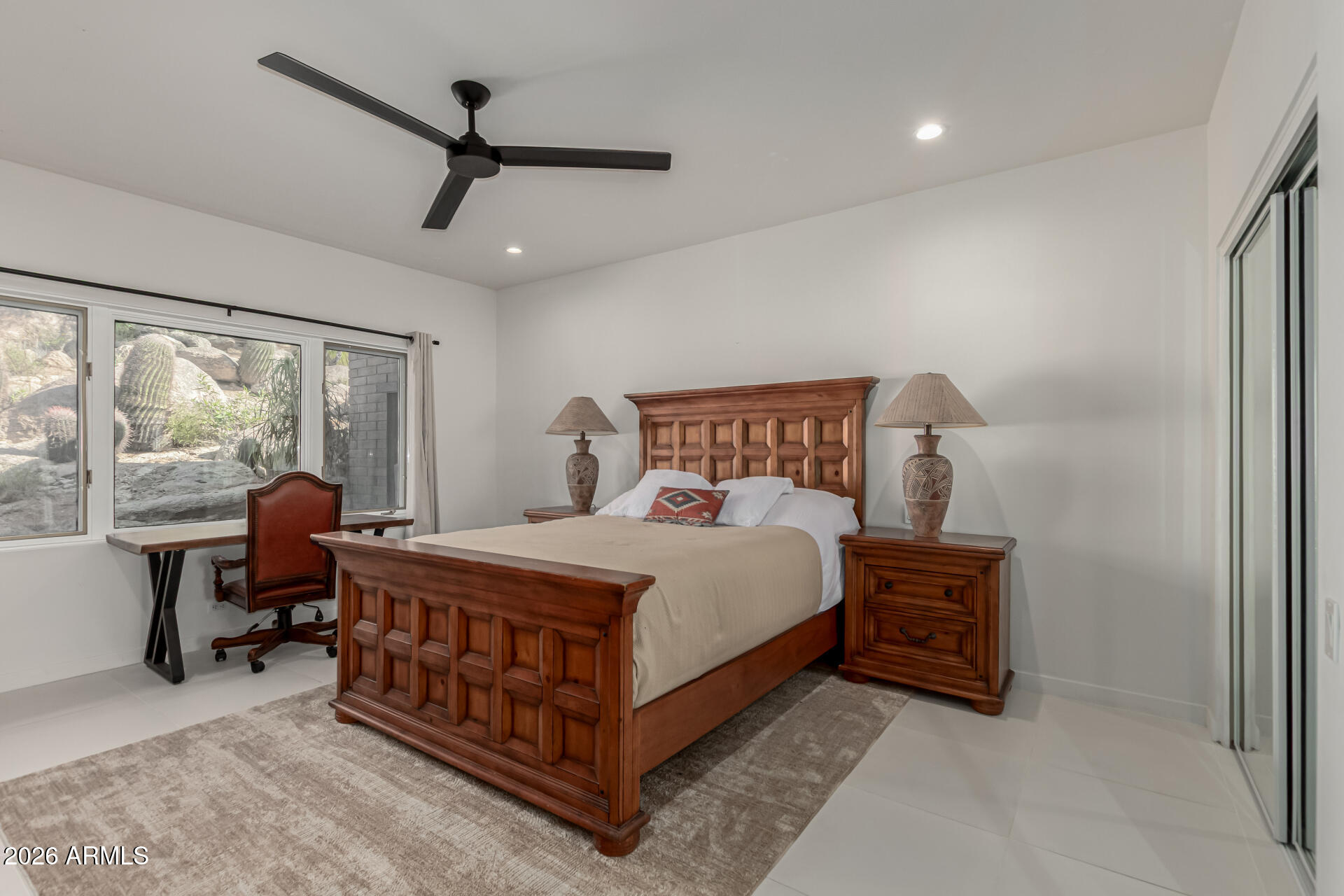 3001 Ironwood Road Carefree, AZ 85377 - Photo 22 of 31 a bedroom with a bed table chair and window