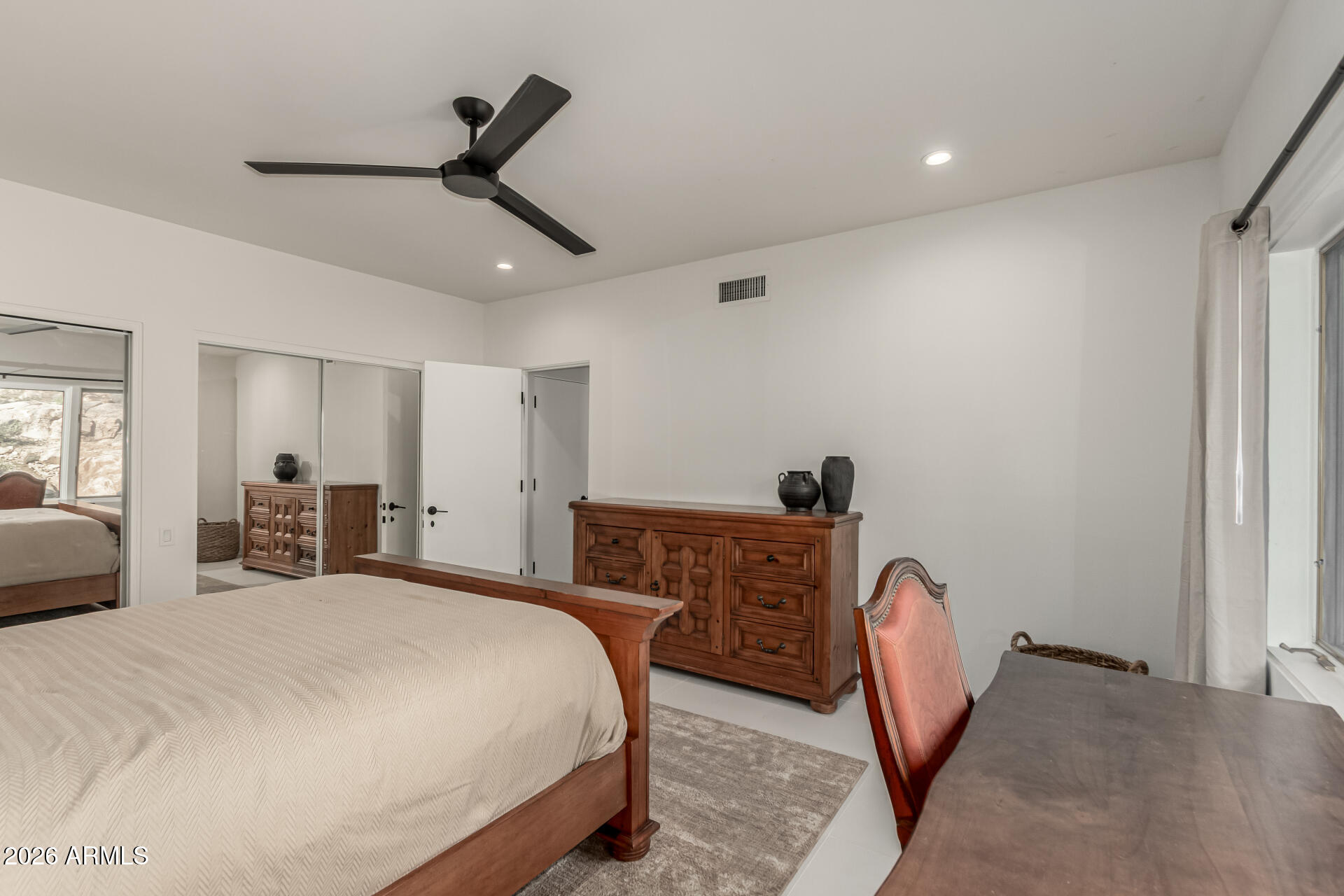 3001 Ironwood Road Carefree, AZ 85377 - Photo 23 of 31 a bedroom with a bed a desk and chair