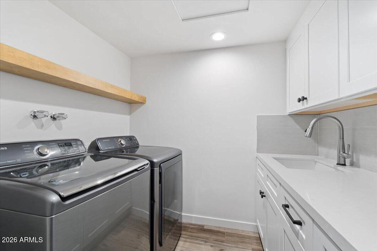 3001 Ironwood Road Carefree, AZ 85377 - Photo 26 of 31 a utility room with sink dryer and washer