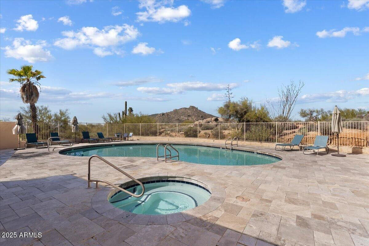 3001 Ironwood Road Carefree, AZ 85377 - Photo 29 of 31 a view of a swimming pool with a lounge chairs