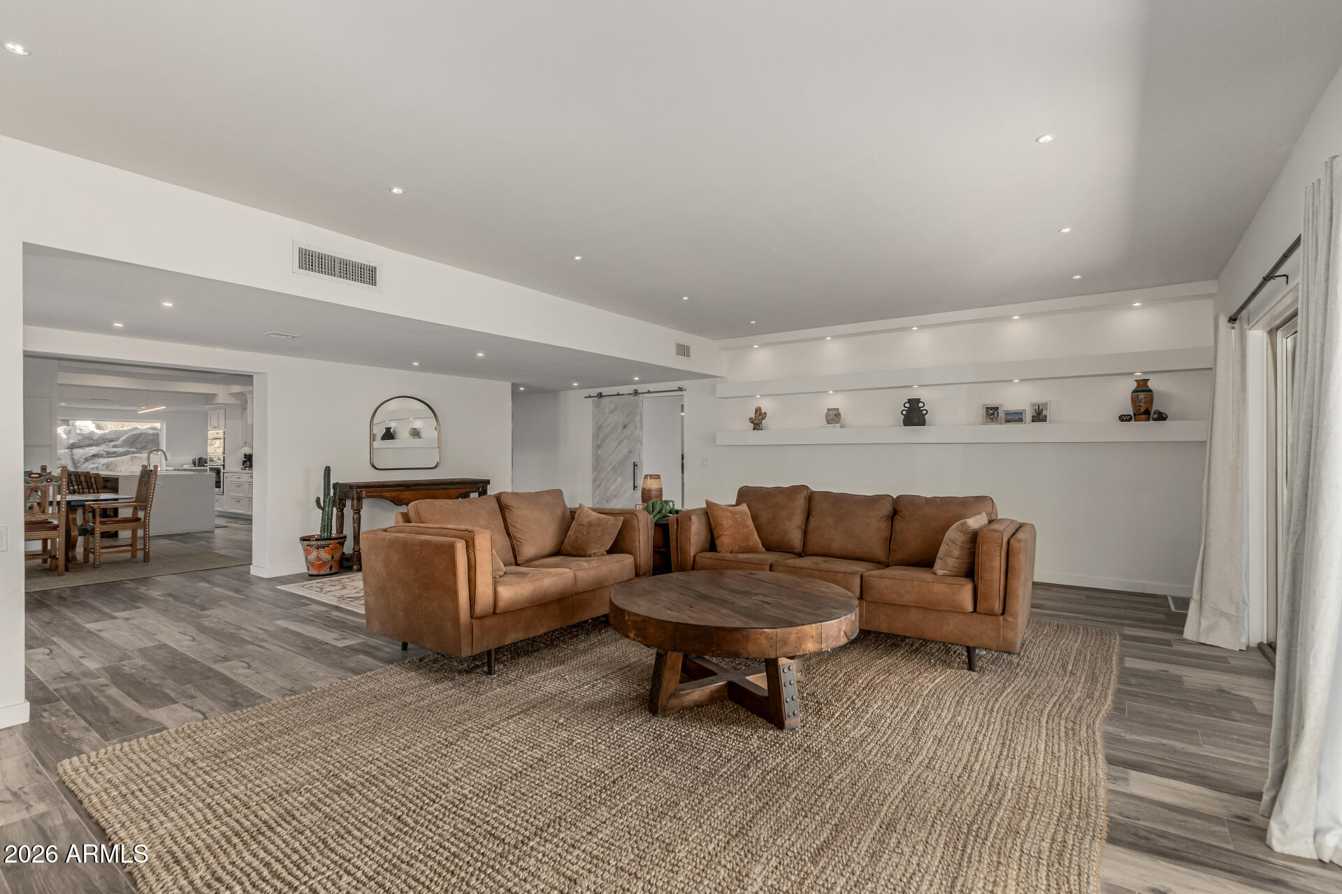 3001 Ironwood Road Carefree, AZ 85377 - Photo 9 of 31 a living room with furniture and a wooden floor