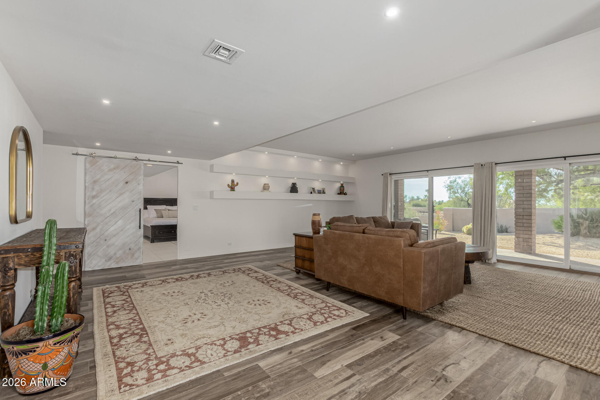 3001 Ironwood Road Carefree, AZ 85377 - Photo 10 of 31 a living room with furniture and a flat screen tv