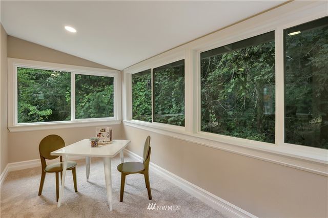 a view of a dining room with furniture window and outside view