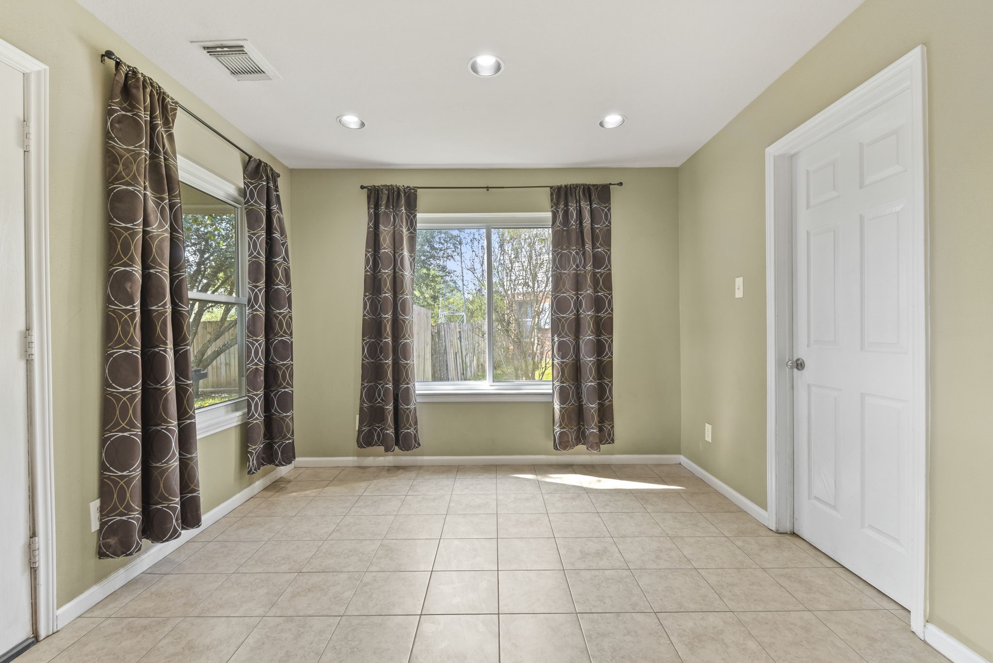 5406 Gate Canyon Court Spring, TX 77373 - Photo 13 of 47 a view of an empty room with a birdcage and a window