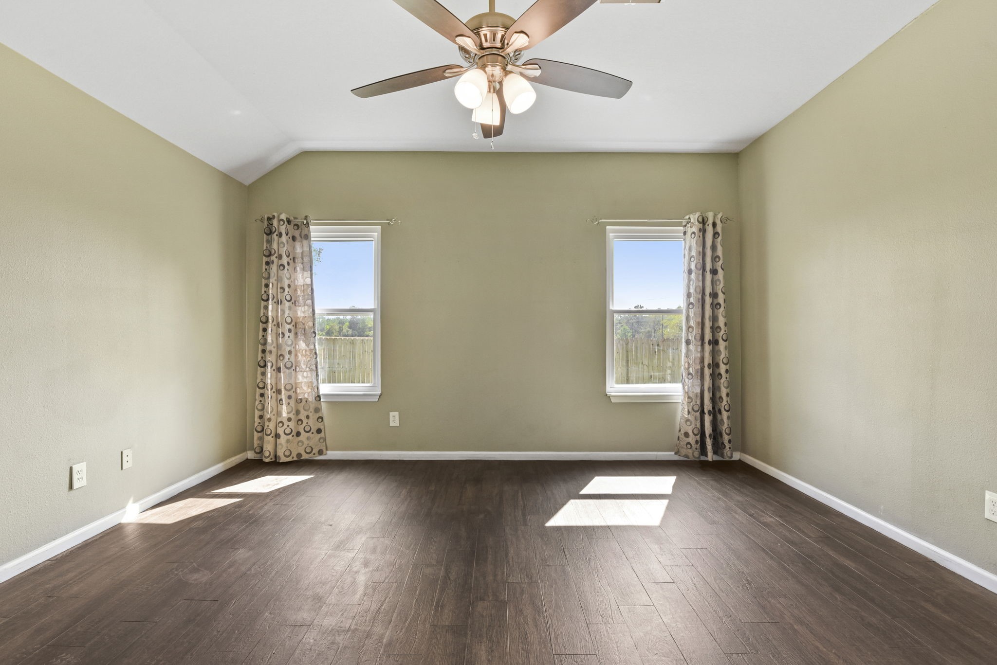 5406 Gate Canyon Court Spring, TX 77373 - Photo 20 of 47 an empty room with wooden floor and windows