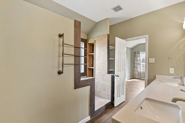 a bathroom with a tub and shower