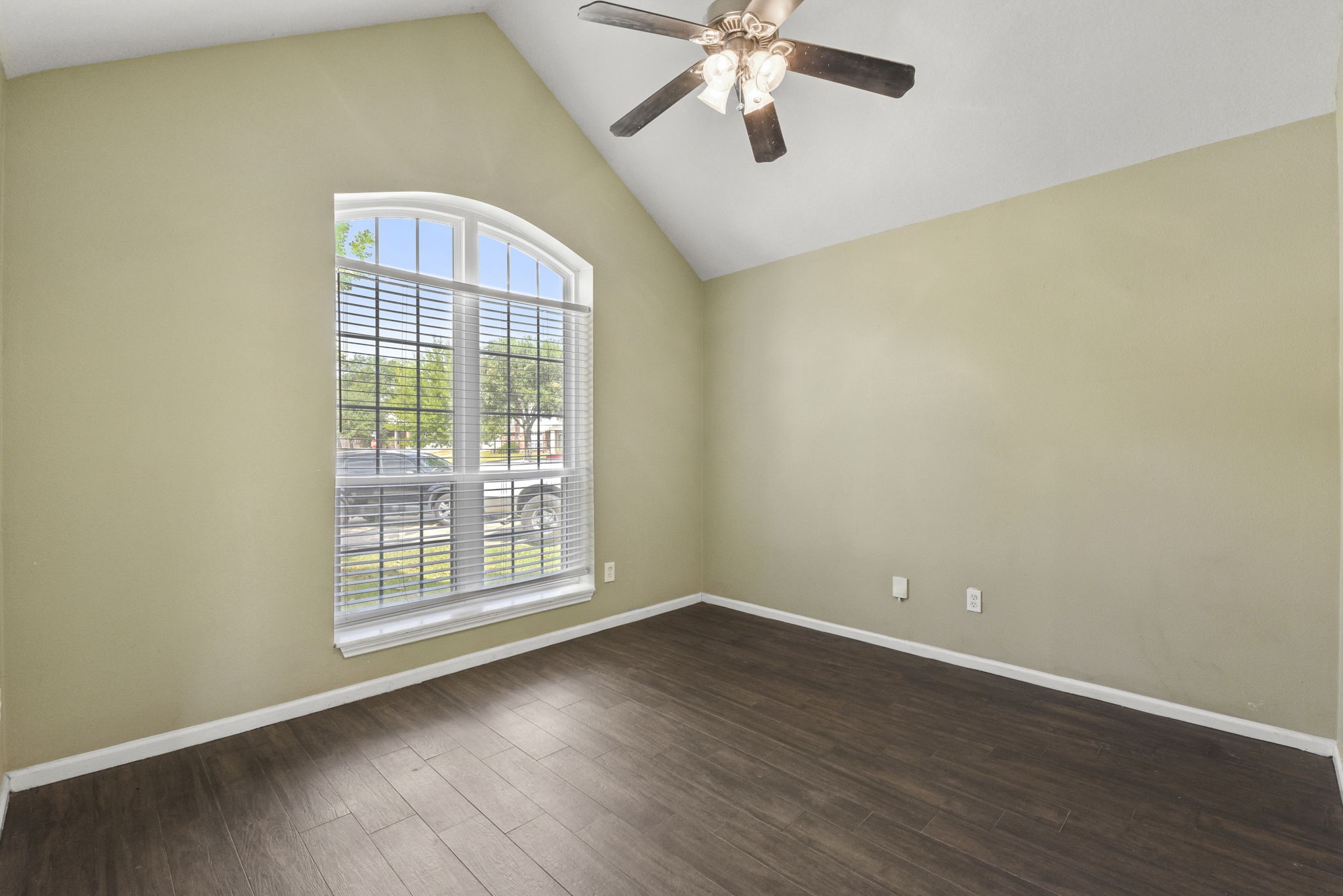 5406 Gate Canyon Court Spring, TX 77373 - Photo 28 of 47 an empty room with wooden floor fan and windows