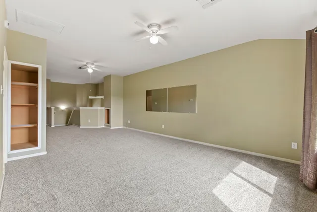 a view of an empty room with a window