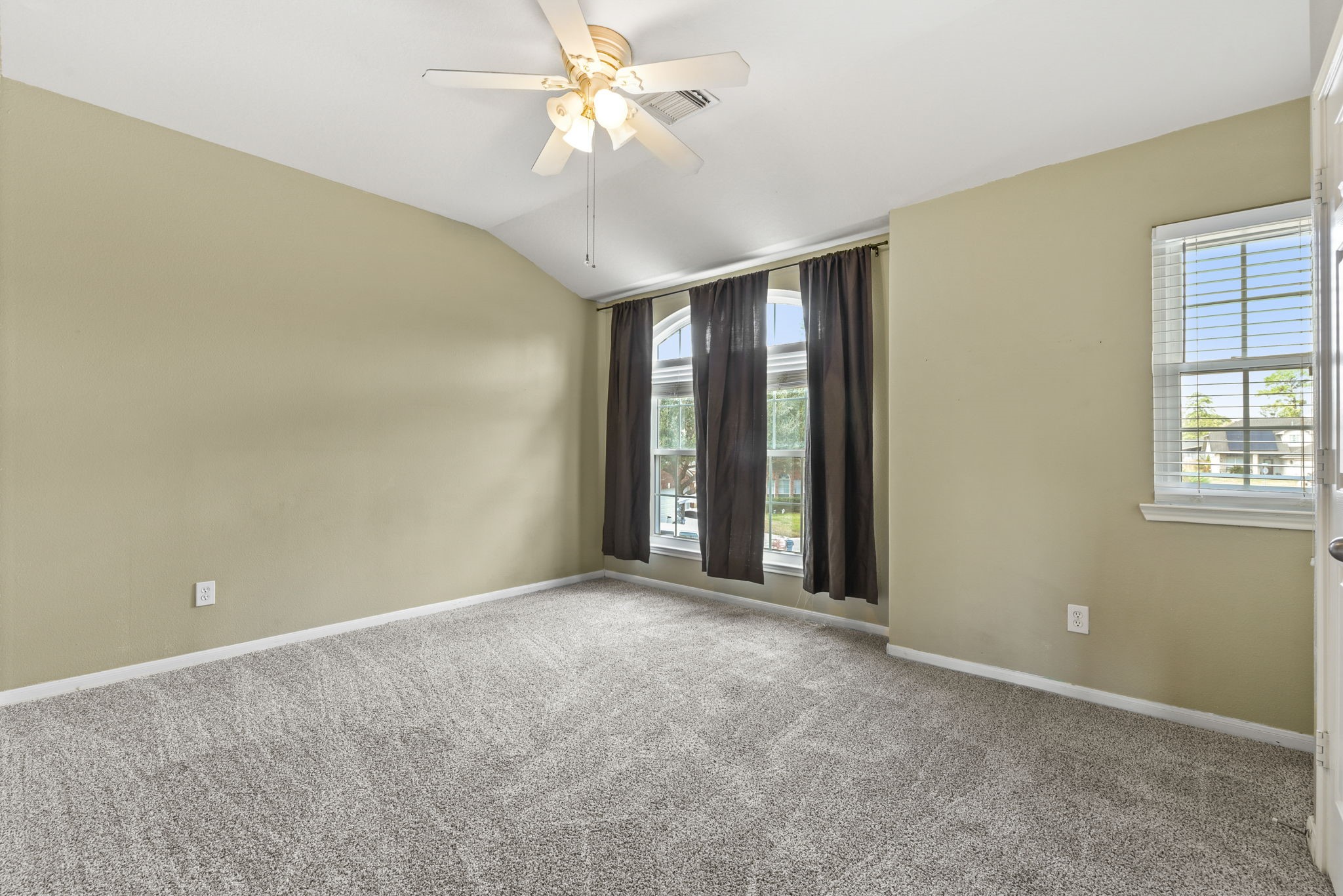 5406 Gate Canyon Court Spring, TX 77373 - Photo 36 of 47 an empty room with windows and fan