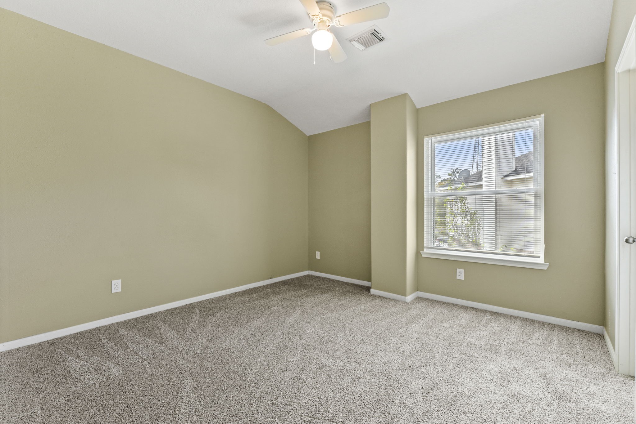 5406 Gate Canyon Court Spring, TX 77373 - Photo 38 of 47 a view of an empty room with chandelier fan and fire place