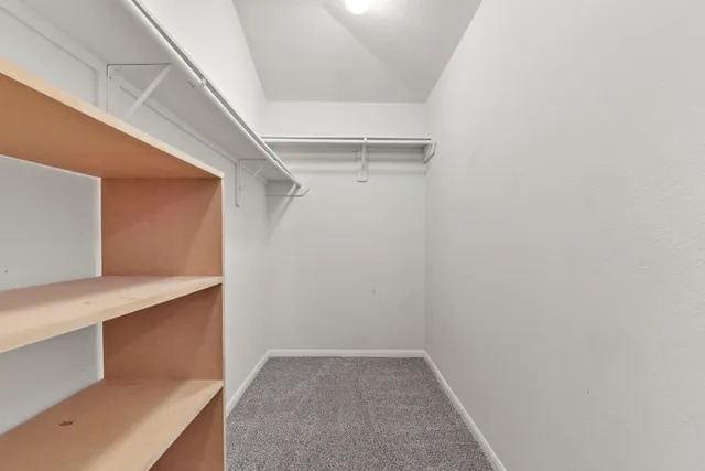 a view of an empty walk in closet