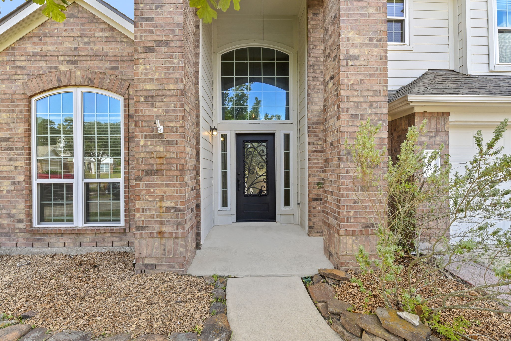 5406 Gate Canyon Court Spring, TX 77373 - Photo 5 of 47 a front view of a house with a garden