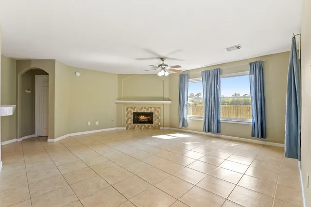 a view of an empty room with a fireplace