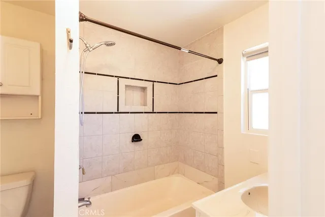 a bathroom with a sink a mirror and a shower