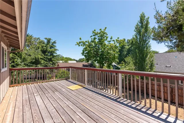 a view of backyard with a deck and wooden floor