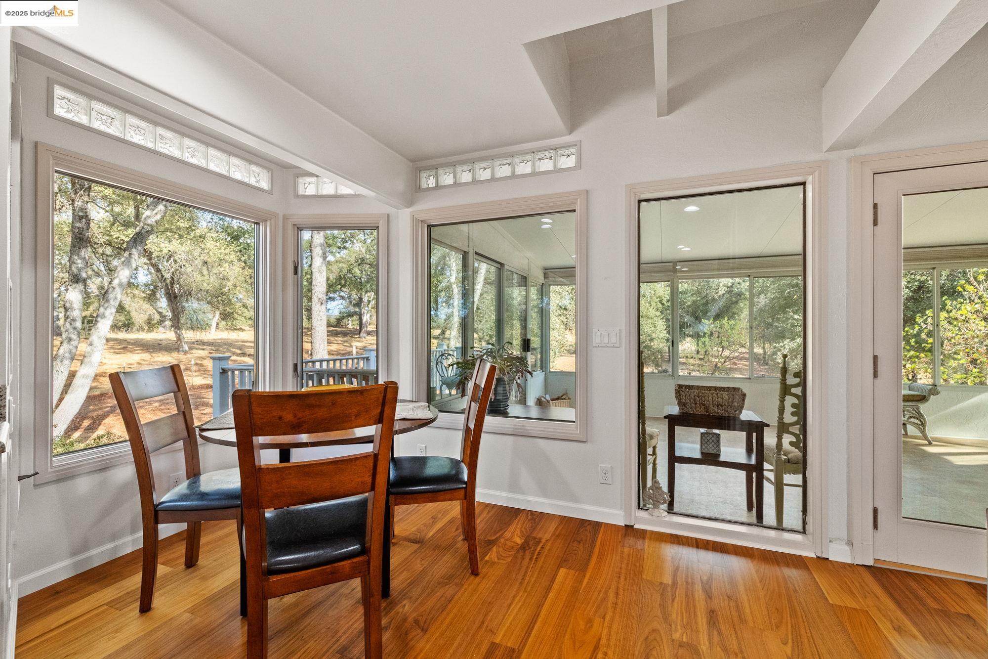 10566 Thistle Down Road Jamestown, CA 95327 - Photo 16 of 53 Sunroom with wood finished floors and baseboards