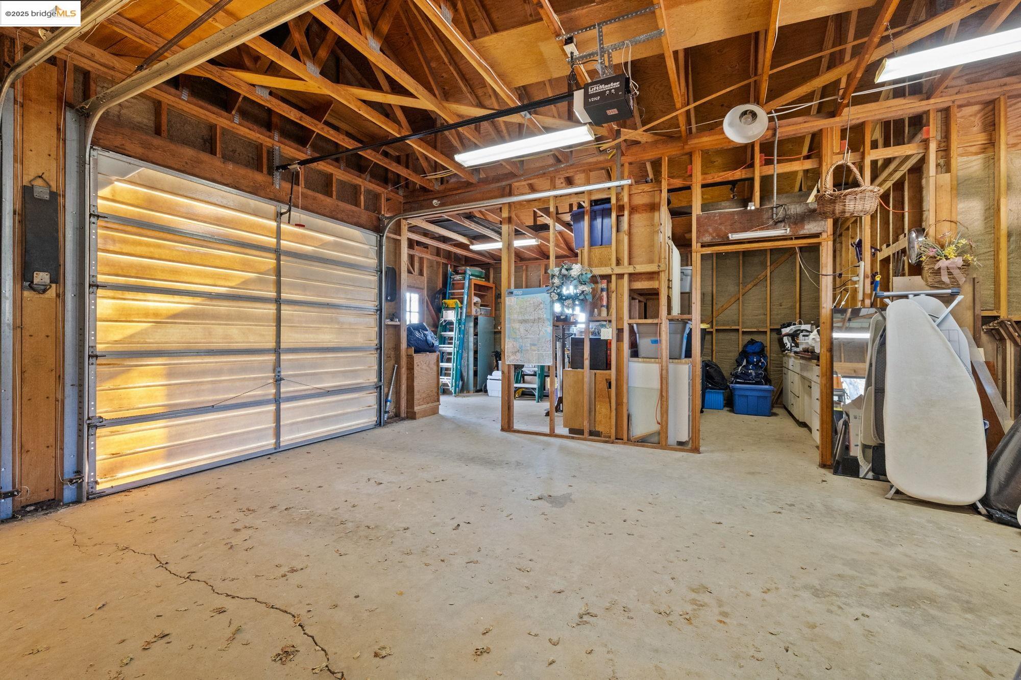 10566 Thistle Down Road Jamestown, CA 95327 - Photo 35 of 53 Garage with a garage door opener