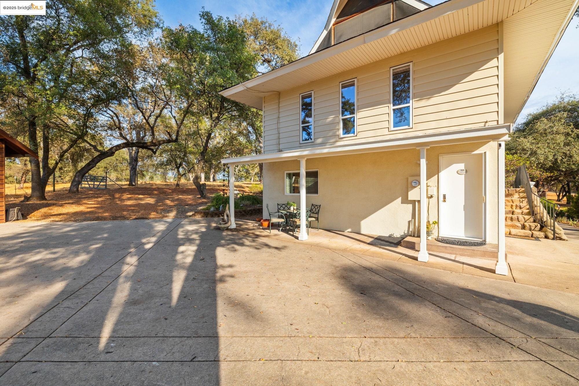 10566 Thistle Down Road Jamestown, CA 95327 - Photo 39 of 53 Rear view of property with stucco siding and a patio