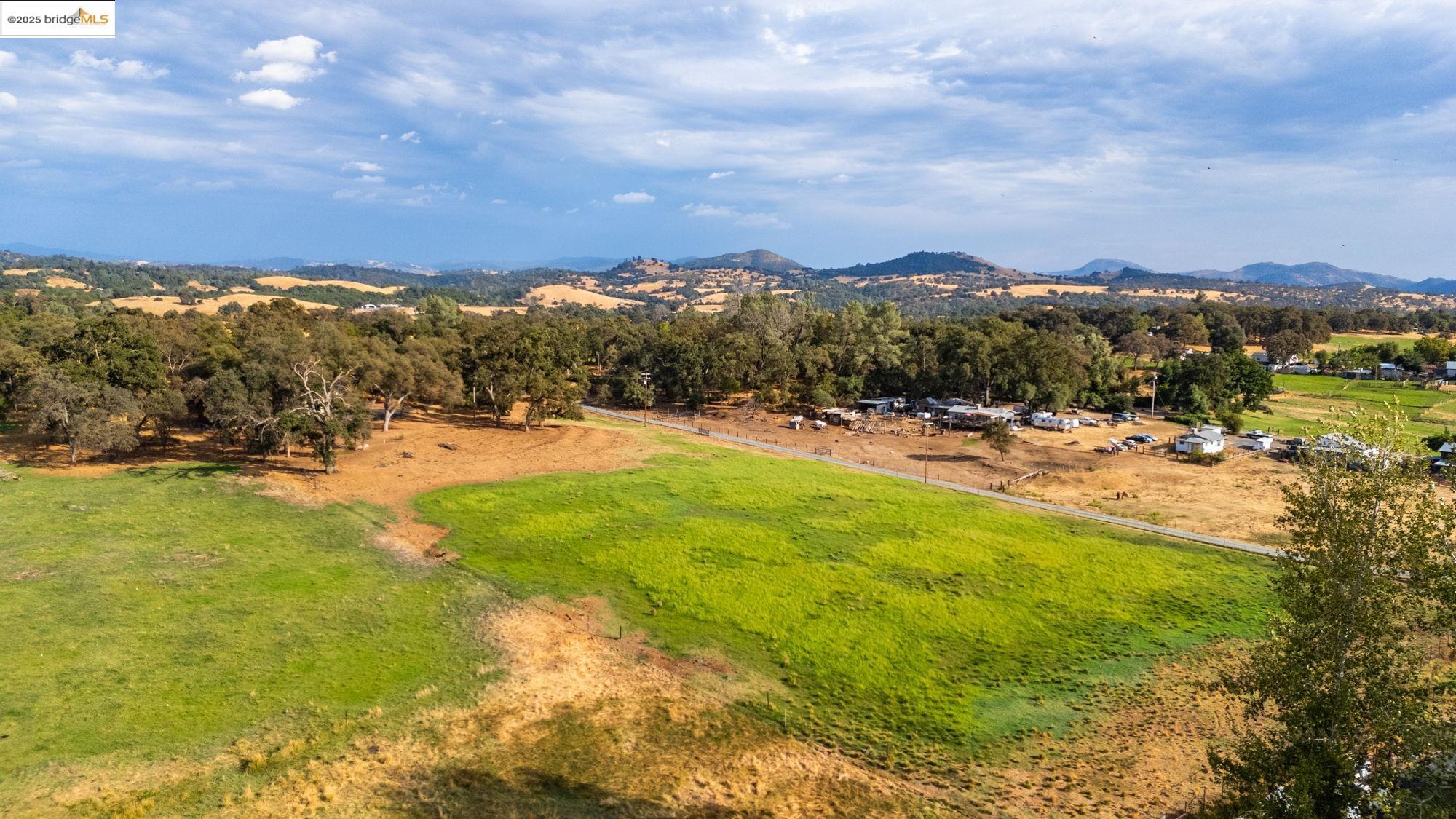 10566 Thistle Down Road Jamestown, CA 95327 - Photo 49 of 53 Overview of rural landscape with a mountain backdrop