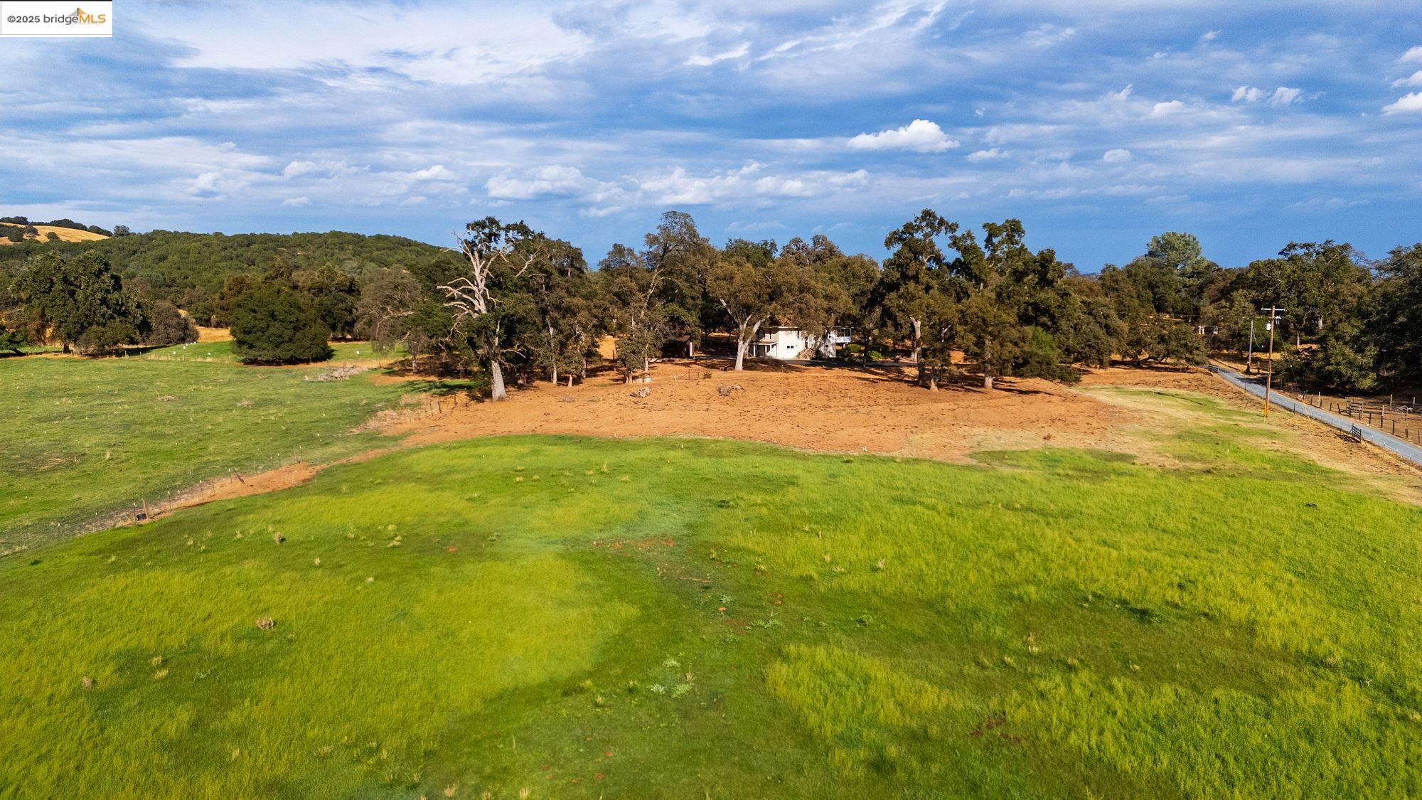 10566 Thistle Down Road Jamestown, CA 95327 - Photo 51 of 53 View of yard featuring view of wooded area and a view of countryside
