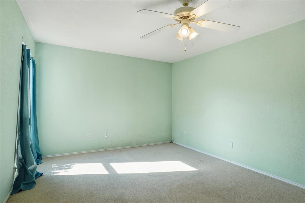 827 West Harwood Road, Unit D Hurst, TX 76054 - Photo 19 of 24 Large secondary bedroom with 2 closets, possible 2nd master suite...