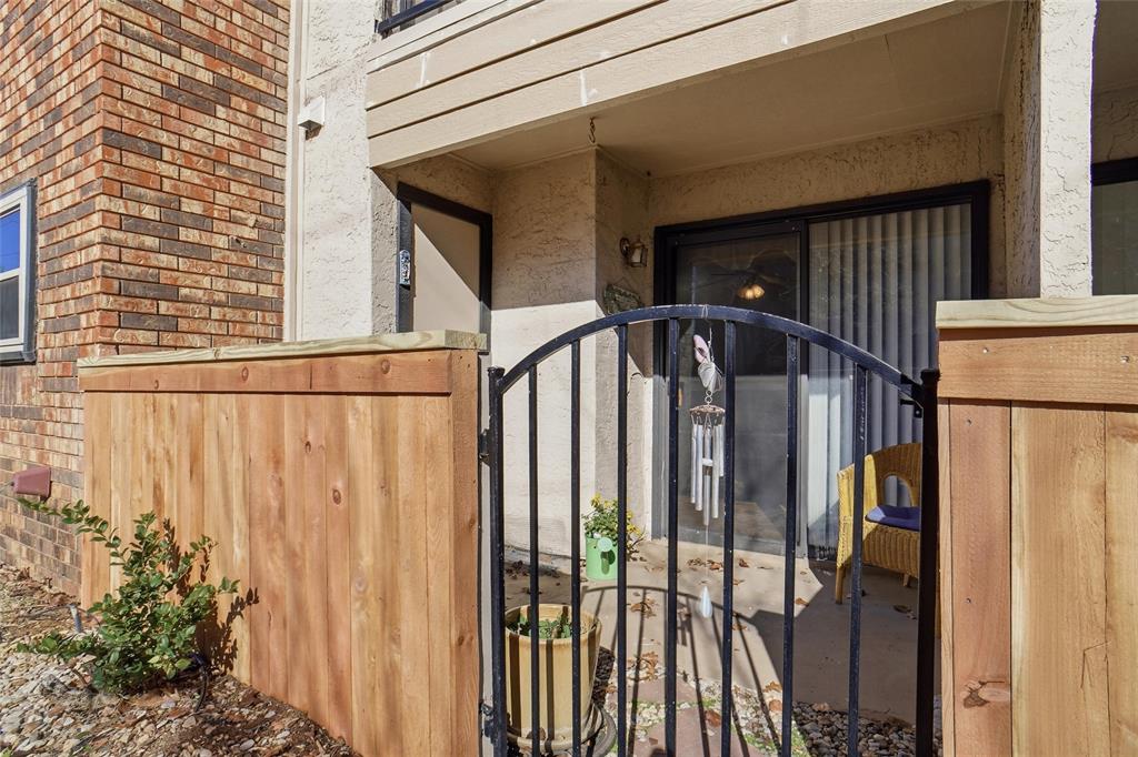 827 West Harwood Road, Unit D Hurst, TX 76054 - Photo 23 of 24 Private fenced patio opens to grassy area...